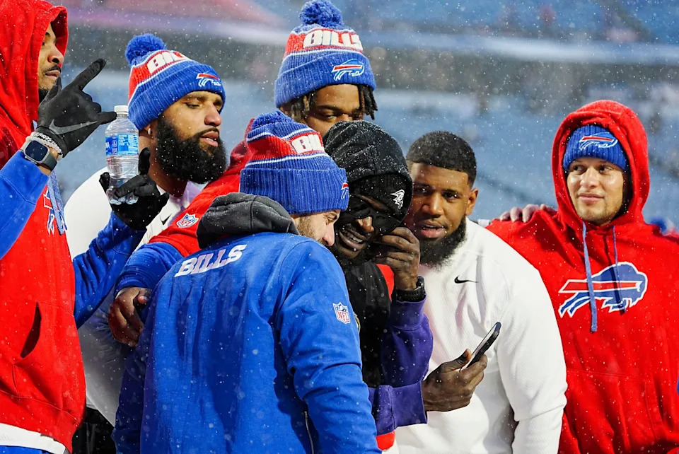 Baltimore Ravens and former BIlls Tre'Davious White, stops to hug former teammates and pulls out a phone to take a selfie with them before the Buffalo Bills divisional game against the Baltimore Ravens at Highmark Stadium in Orchard Park on Jan. 19, 2025.