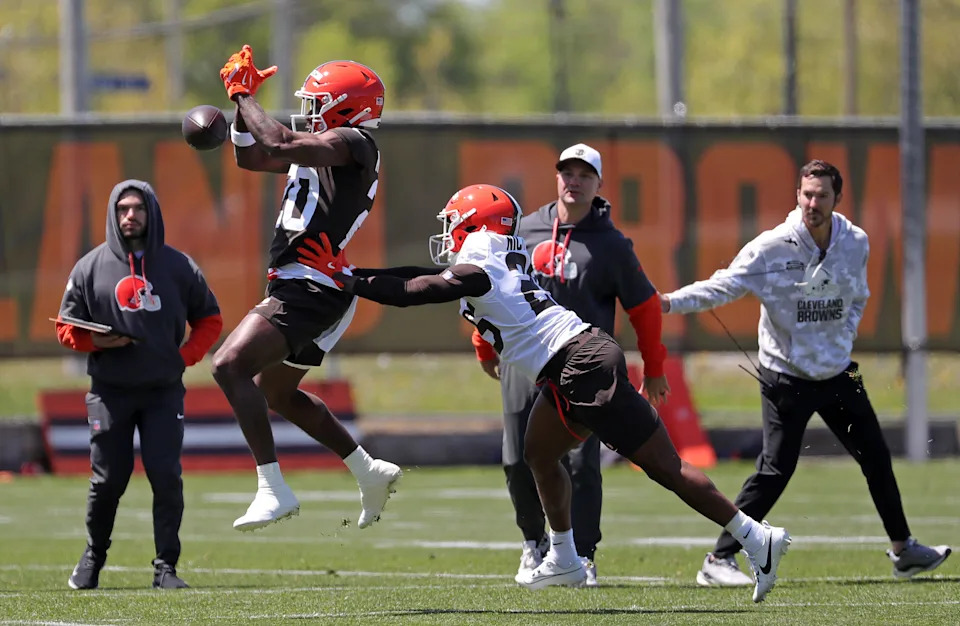 Wide receiver Kisean Johnson, left, tries to hang onto a pass over cornerback Tahveon Nicholson during NFL rookie minicamp at the Cleveland Browns training facility on Friday, May 9, 2025, in Berea, Ohio.