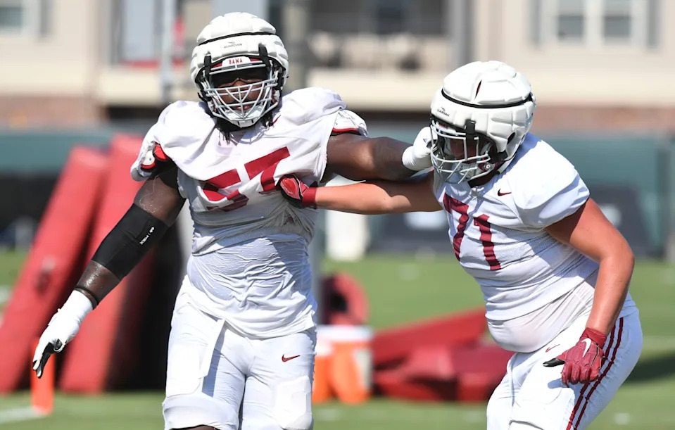 The Crimson Tide players and coaches continue working toward the season opener in practice Tuesday, Aug. 13, 2024. Alabama offensive lineman Elijah Pritchett (57) blocks Alabama offensive lineman Jackson Howell (71).