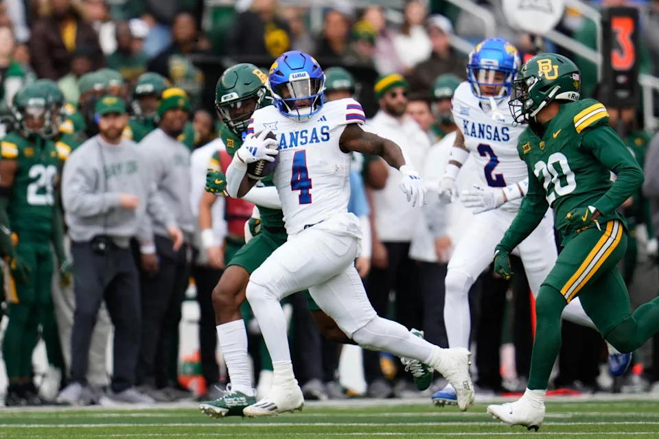 Kansas Jayhawks running back Devin Neal (4) runs against the Baylor Bears. Mandatory Credit: Chris Jones-Imagn Images