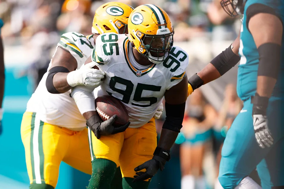 Oct 27, 2024; Jacksonville, Florida, USA; Green Bay Packers defensive lineman Devonte Wyatt (95) recovers a fumble against the Jacksonville Jaguars during the second quarter at EverBank Stadium. Mandatory Credit: Morgan Tencza-Imagn Images