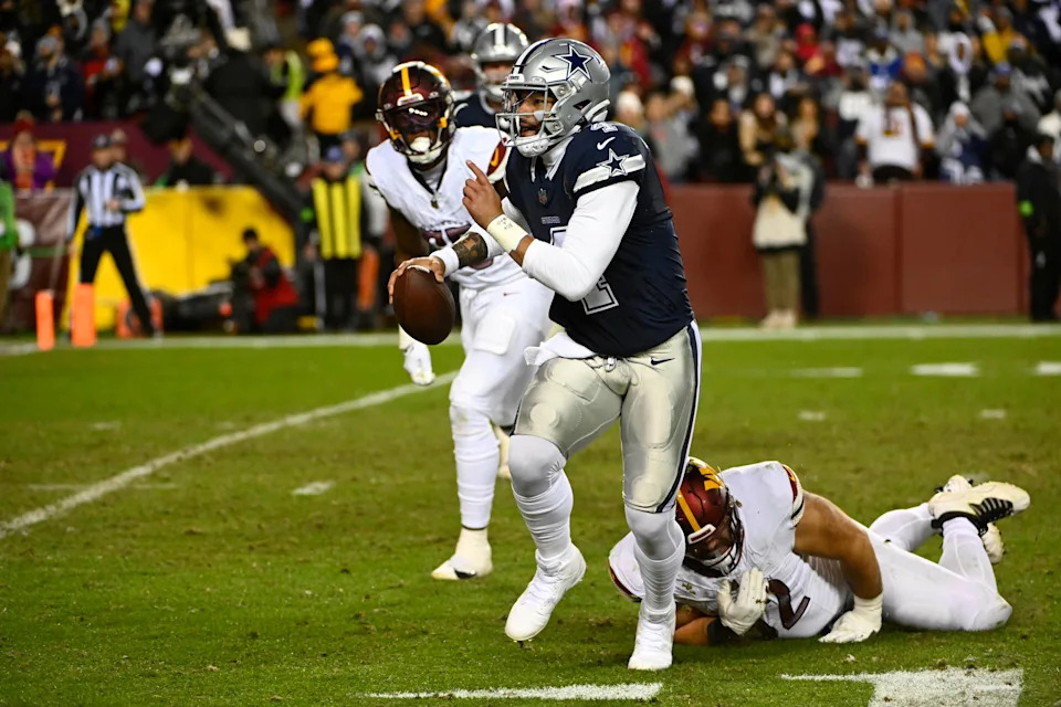Jan 7, 2024; Landover, Maryland, USA; Dallas Cowboys quarterback Dak Prescott (4) carries the ball against the Washington Commanders during the second half at FedExField. Mandatory Credit: Brad Mills-USA TODAY Sports