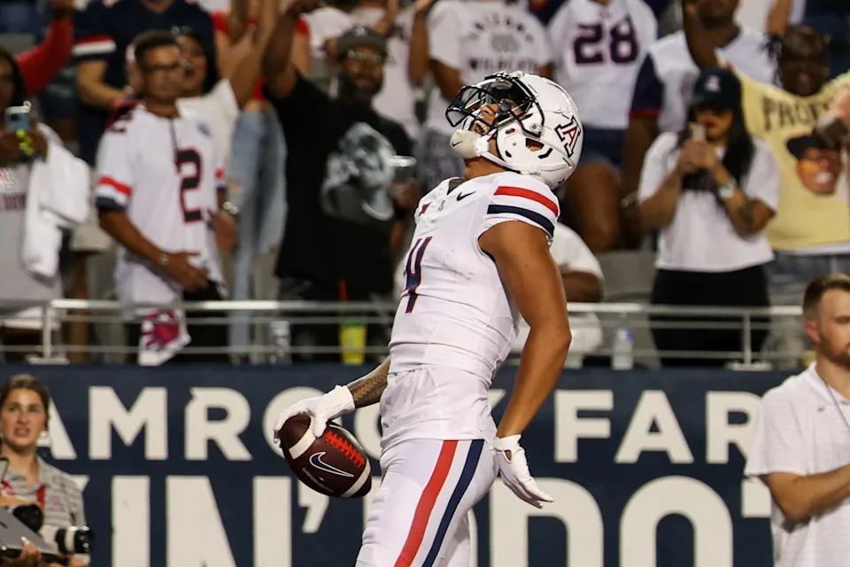 Aug 31, 2024; Tucson, Arizona, USA; Arizona Wildcats wide receiver Tetairoa McMillan (4) celebrates touchdown during first quarter at Arizona Stadium. Mandatory Credit: Aryanna Frank-USA TODAY Sports
