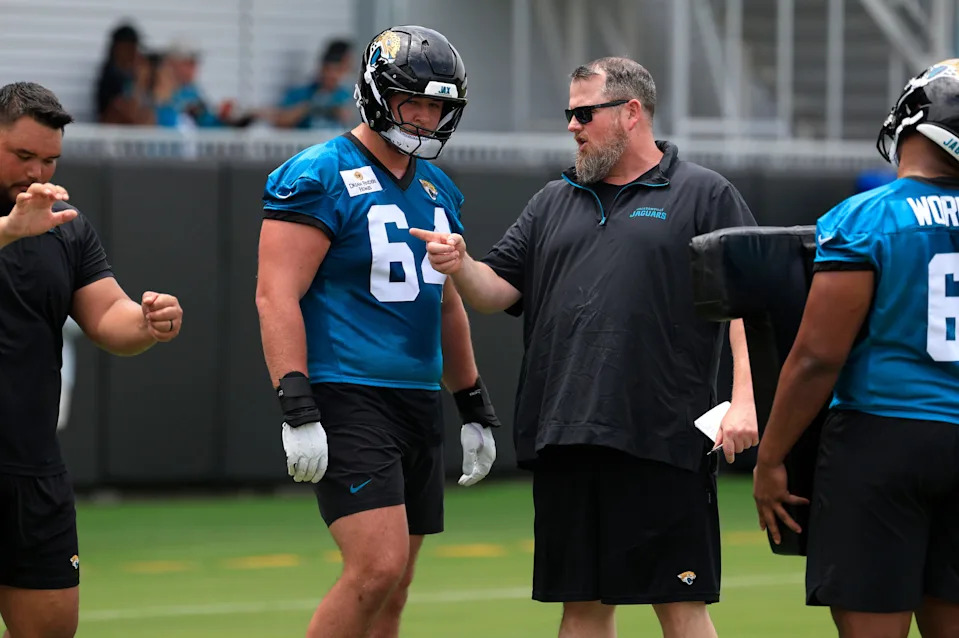 Jacksonville Jaguars guard Wyatt Milum (64) listens to offensive line coach Shaun Sarrett during a rookie minicamp at Miller Electric Center Saturday, May 10, 2025 in Jacksonville, Fla. [Corey Perrine/Florida Times-Union]