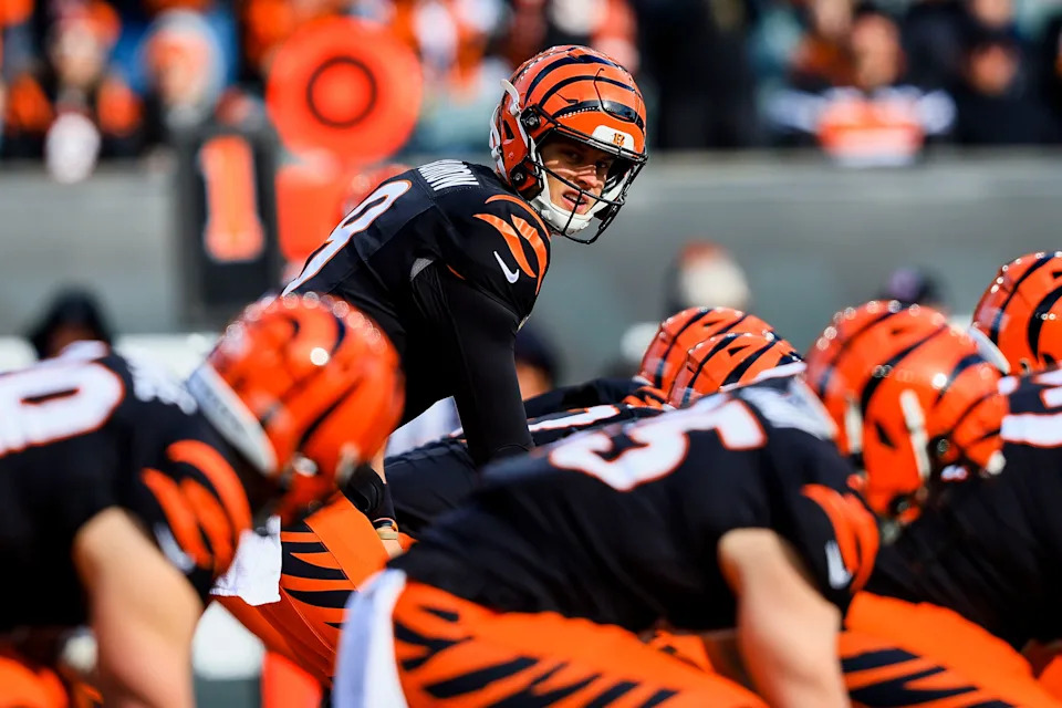Dec 22, 2024; Cincinnati, Ohio, USA; Cincinnati Bengals quarterback Joe Burrow (9) prepares to snap the ball against the Cleveland Browns in the first half at Paycor Stadium.
