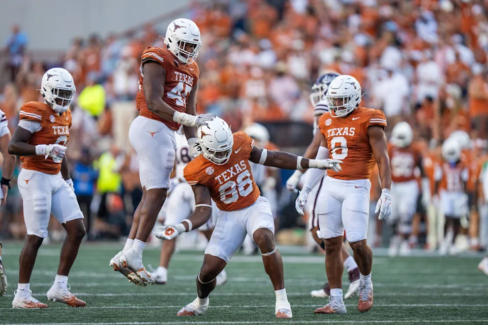 Texas edge rusher Barryn Sorrell, center, and fellow defensive players react to a play during the Longhorns' win over Mississippi State on Sept. 28 at Royal-Memorial Stadium.
