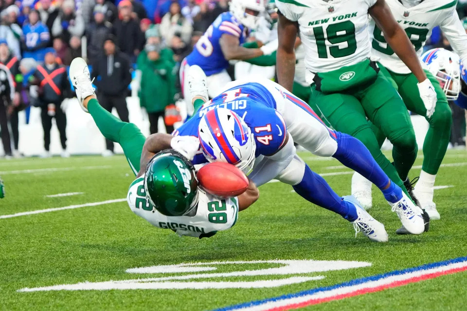 Nov 19, 2023; Orchard Park, New York, USA; Buffalo Bills full back Reggie Gilliam (41) tackles and knocks the ball loose from New York Jets wide receiver Xavier Gipson (82) during the first half at Highmark Stadium. Mandatory Credit: Gregory Fisher-USA TODAY Sports