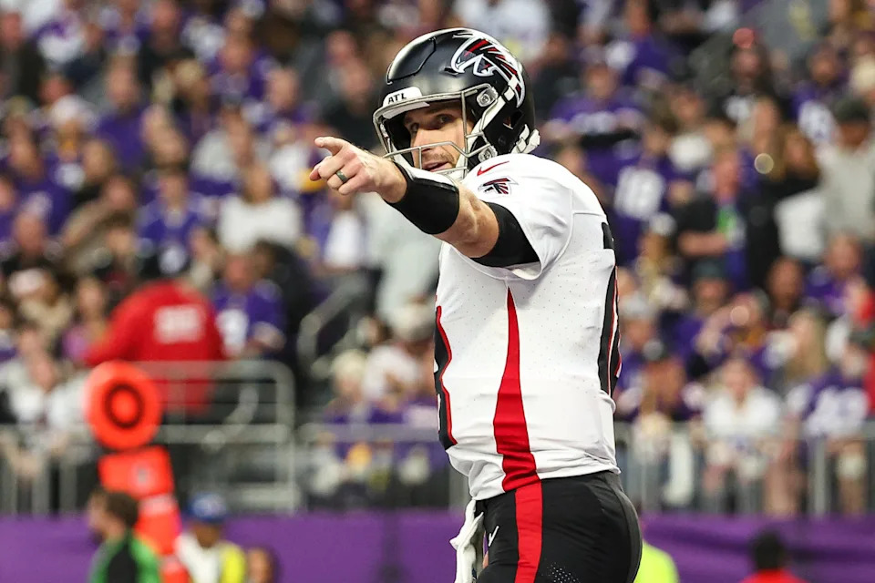 Dec 8, 2024; Minneapolis, Minnesota, USA; Atlanta Falcons quarterback Kirk Cousins (18) celebrates running back Bijan Robinson's (7) touchdown against the Minnesota Vikings during the third quarter at U.S. Bank Stadium.© Matt Krohn-Imagn Images