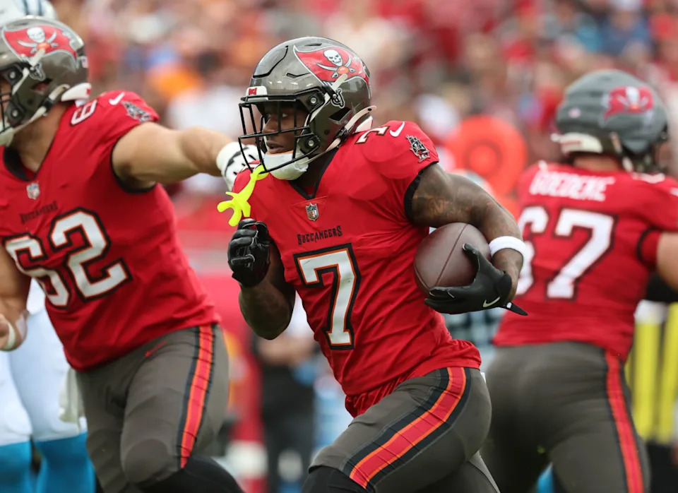 Dec 29, 2024; Tampa, Florida, USA; Tampa Bay Buccaneers running back Bucky Irving (7) carries the ball against the Carolina Panthers during the first quarter at Raymond James Stadium.© Kim Klement Neitzel-Imagn Images