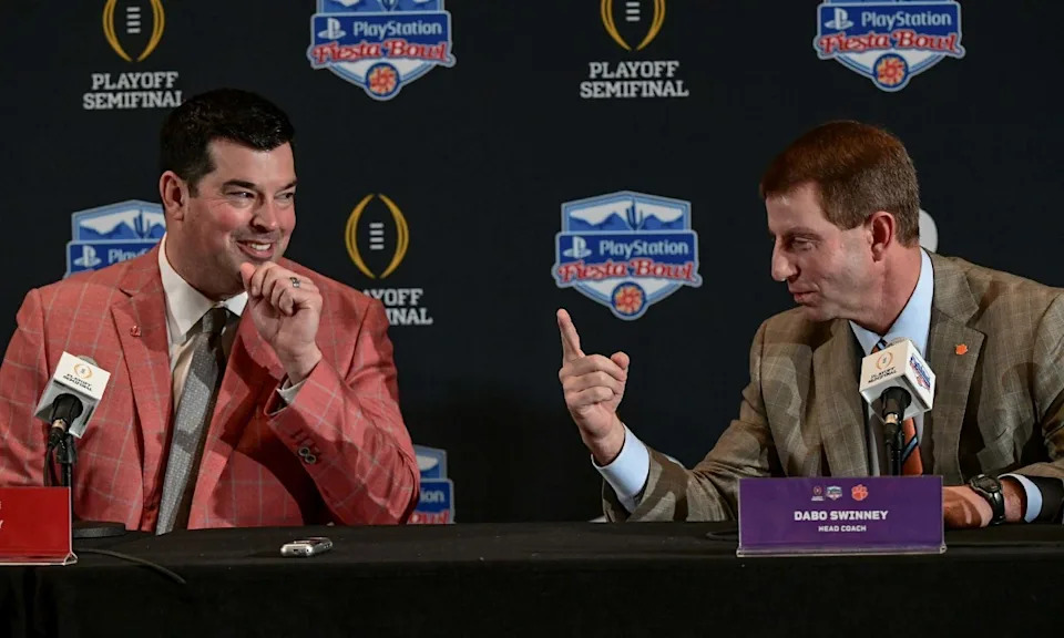Clemson coach Dabo Swinney, right, and Ohio State coach Ryan Day before last year's semifinal. A rematch is set for Jan. 1. Clemson Fans Fiesta Bowl Coaches Conference© KEN RUINARD / Greenville News via Imagn Content Services, LLC
