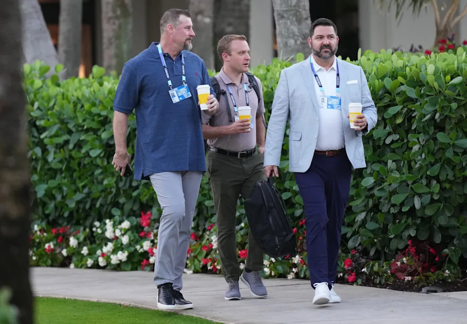 Dan Campbell (left) shares a coffee with two others at the NFL Annual Meeting in Palm Beach, Florida. © Jim Rassol-Imagn Images