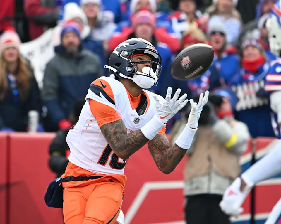 Jan 12, 2025; Orchard Park, New York, USA; Denver Broncos wide receiver Troy Franklin (16) catches a touchdown pass against the Buffalo Bills during the first quarter in an AFC wild card game at Highmark Stadium. Mandatory Credit: Mark Konezny-Imagn Images