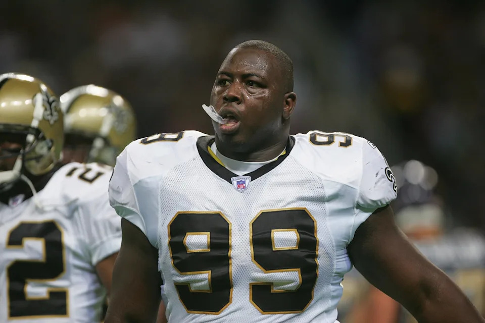 ST. LOUIS - SEPTEMBER 26: Defensive tackle Shaun Smith #99 of the New Orleans Saints is on the field during the game against the St. Louis Rams at the Edward Jones Dome on September 26, 2004 in St. Louis, Missouri. Saints defeated the Rams 28-25 in overtime. (Photo by Harry How/Getty Images)