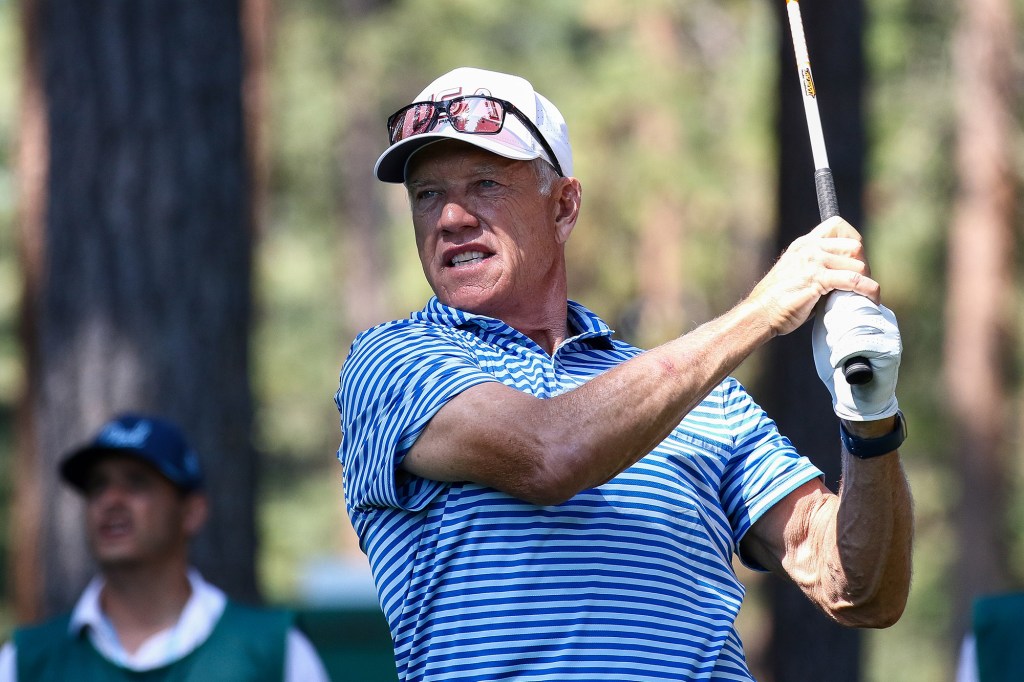 Former NFL football player John Elway hits his tee on the second hole on day one of the 2024 American Century Championship at Edgewood Tahoe Golf Course on July 12, 2024 in Stateline, Nevada.