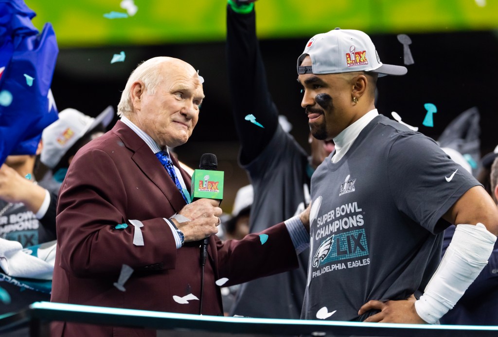 Fox Sports announcer Terry Bradshaw interviews Philadelphia Eagles quarterback Jalen Hurts (1) after defeating the Kansas City Chiefs during Super Bowl LIX at Ceasars Superdome. 