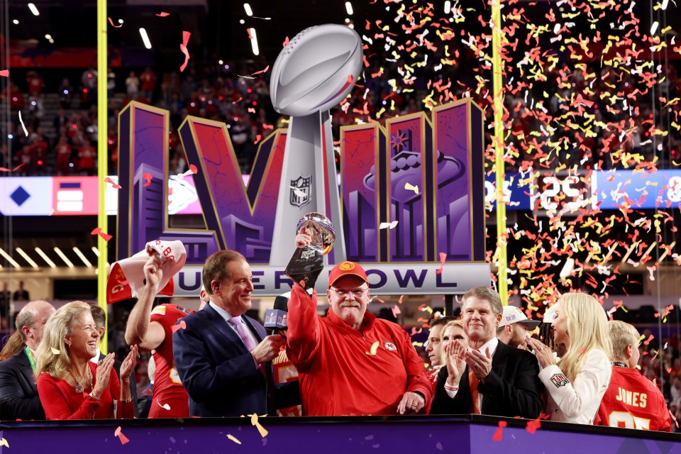Andy Reid holding the Lombardi Trophy after the Kansas City Chiefs Super Bowl LVIII victory.