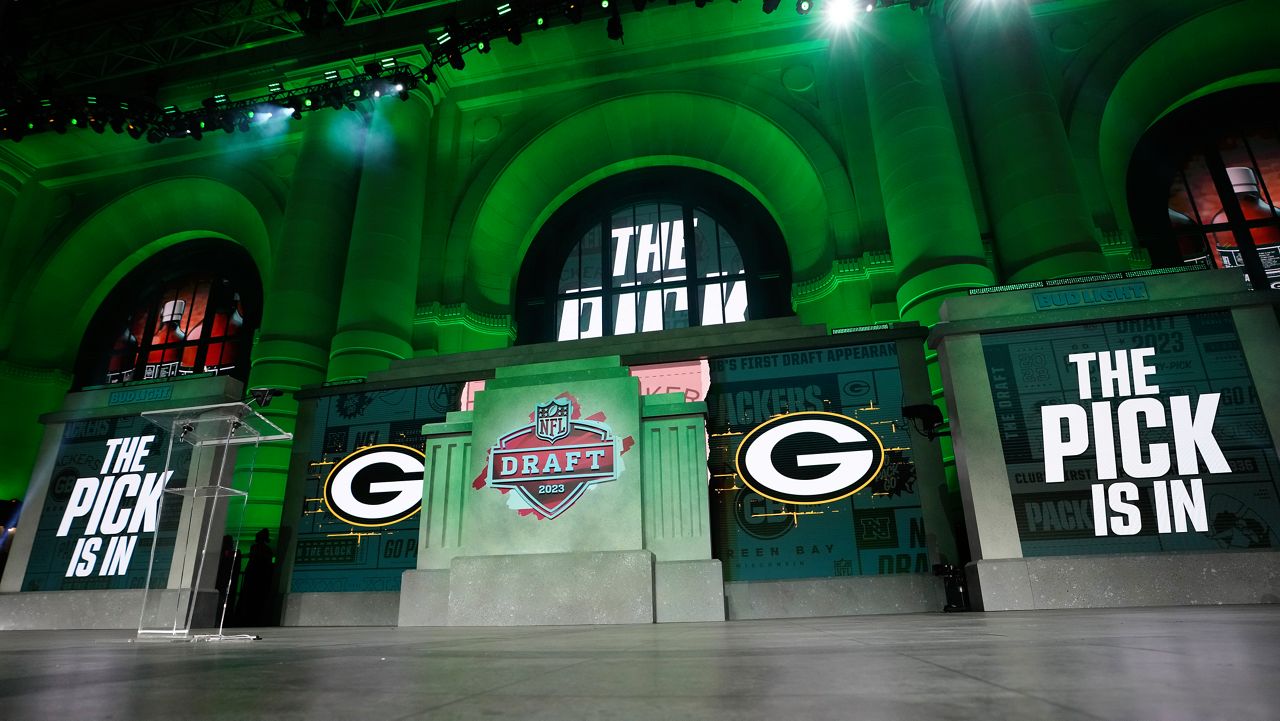 The onstage video screens display "The Pick Is In" for the Green Bay Packers during the 2023 NFL Draft, Thursday, April 27, 2023, in Kansas City, Mo.