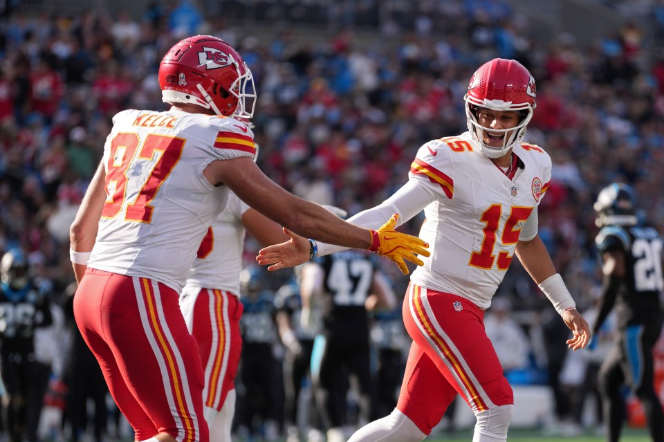 Patrick Mahomes #15 and Travis Kelce #87 of the Kansas City Chiefs celebrating a touchdown.