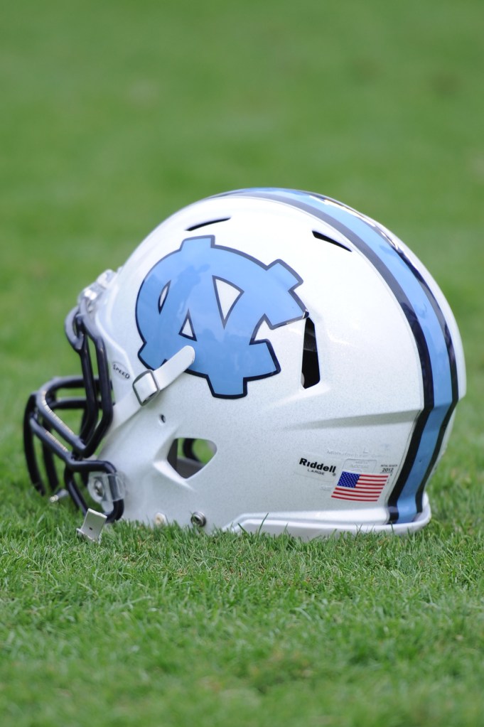 North Carolina Tar Heels football helmet on the field during a game at Kenan Memorial Stadium, representing the UNC academic fraud investigation.