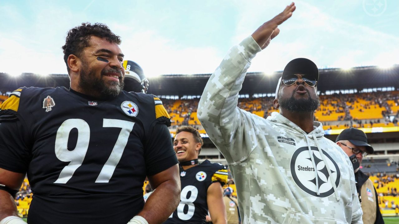 Cameron Heyward and head coach Mike Tomlin exit the field after a 2024 victory over the Baltimore Ravens