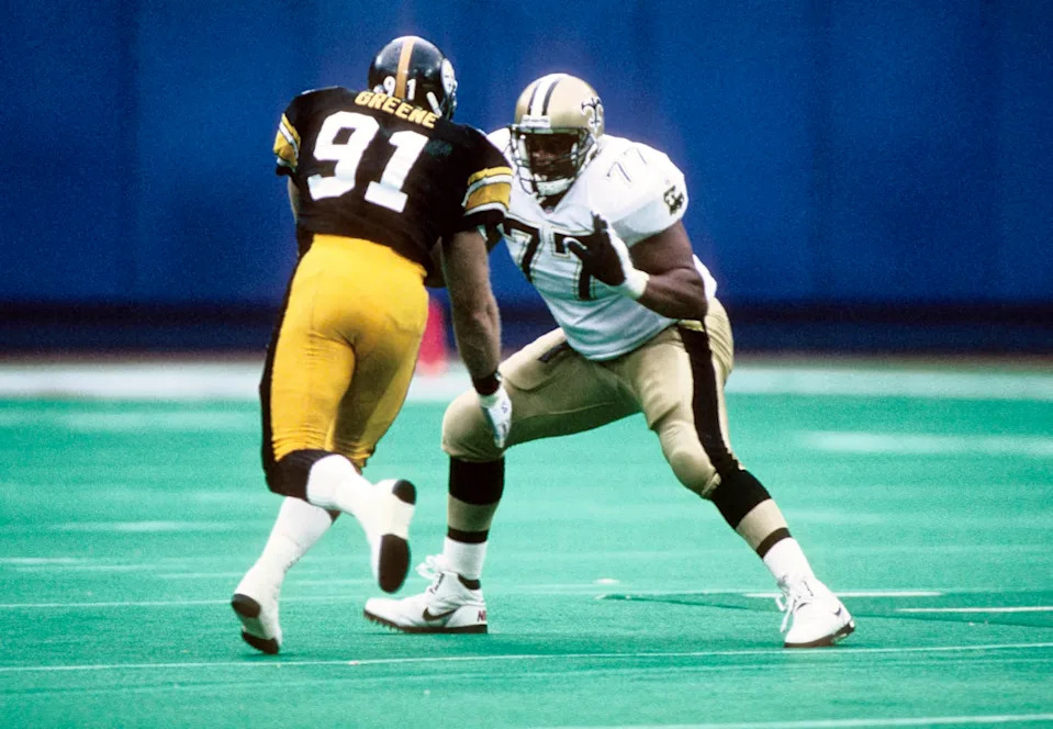 Oct 17, 1993; FILE PHOTO; New Orleans Saints tackle Willie Roaf (77) blocks Pittsburgh Steelers linebacker Kevin Greene (91). Mandatory Credit: Imagn Images