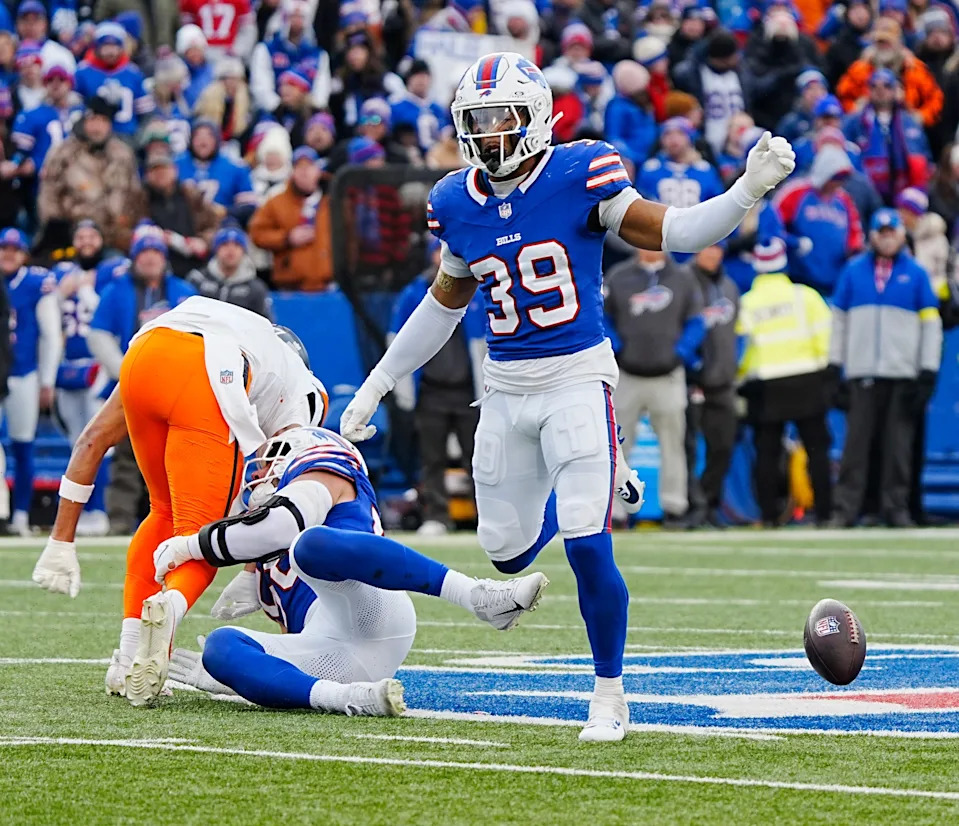Buffalo Bills linebacker Matt Milano and Buffalo Bills cornerback Cam Lewis break up.a pass during the second half of the Buffalo Bills wild card game against the Denver Broncos at Highmark Stadium in Orchard Park on Jan. 12, 2025.