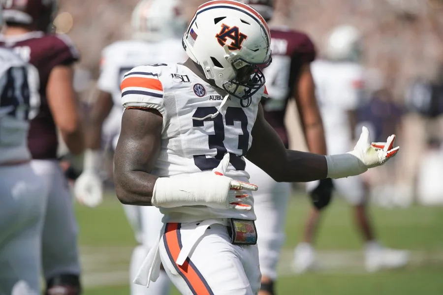 FILE – In this Sept. 21, 2019, file photo, Auburn linebacker K.J. Britt (33) reacts after making a stop against Texas A&M during the first half of an NCAA college football game, in College Station, Texas. Britt was selected to The Associated Press All-Southeastern Conference football team, Monday, Dec. 9, 2019.(AP Photo/Sam Craft, File)