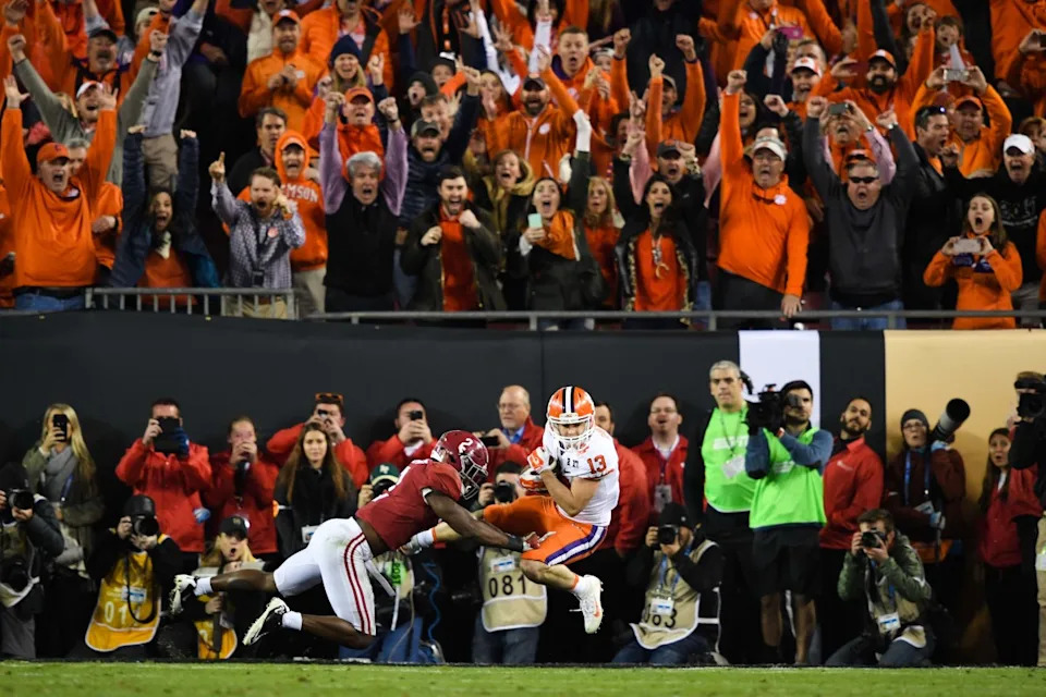 Clemson Tigers wide receiver Hunter Renfrow (13) scores the winning touchdown as Alabama Crimson Tide defensive back Tony Brown (2) defends during the fourth quarter in the 2017 College Football Playoff National Championship Game at Raymond James Stadium. Clemson defeated Alabama 35-31.© John David Mercer-Imagn Images