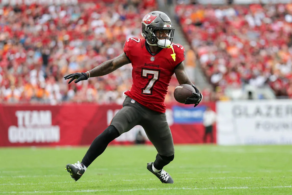 Dec 29, 2024; Tampa, Florida, USA; Tampa Bay Buccaneers running back Bucky Irving (7) runs with the ball against the Carolina Panthers in the third quarter at Raymond James Stadium. Mandatory Credit: Nathan Ray Seebeck-Imagn Images