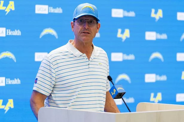 Chargers head coach Jim Harbaugh has been added to the lawsuit against Michigan and Matt Weiss