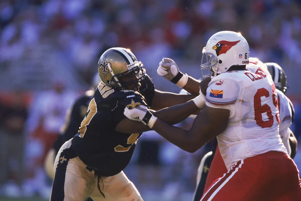 29 Oct 2000: Defensive end Darren Howard #93 of the New Orleans Saints is pushing with tackel Anthony Clement #65 during the game against the Arizona Cardinals at the Sun Devil Stadium in Tempe, Arizona. The Saints defeated the Cardinals 21-10. Mandatory Credit: Todd Warshaw /Allsport
