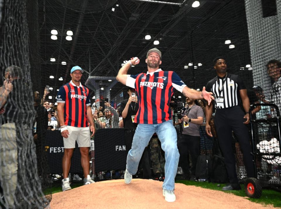 Man in Patriots jersey throwing a baseball.