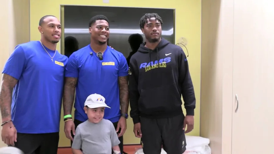 Rams players pose with patients during a visit to Cedars-Sinai on June 13, 2025. (Cedars-Sinai)