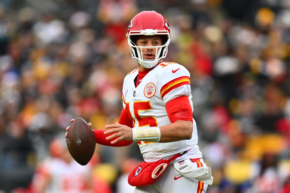 Patrick Mahomes #15 of the Kansas City Chiefs prepares to pass the football.
