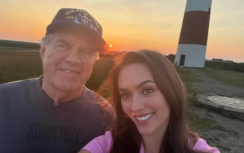 Former NFL coach Bill Belichick and girlfriend Jordon Hudson take a romantic seflie in the sunset