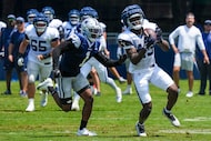 Ex- Dallas Cowboys cornerback Kelvin Joseph (1, left) defends during a training camp...