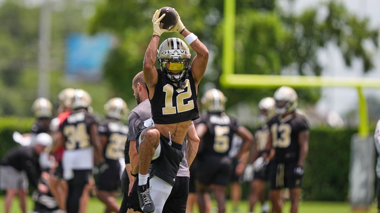 Saints receiver Chris Olave brushes off concussion concerns and laughs off trade talk