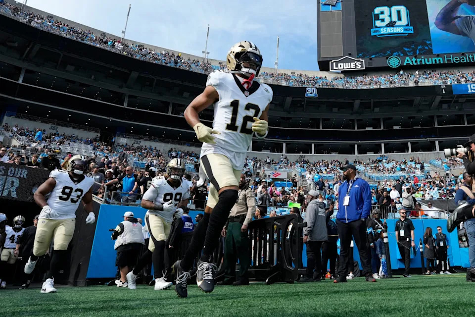 New Orleans Saints wide receiver Chris Olave runs on to the field.Bob Donnan-Imagn Images