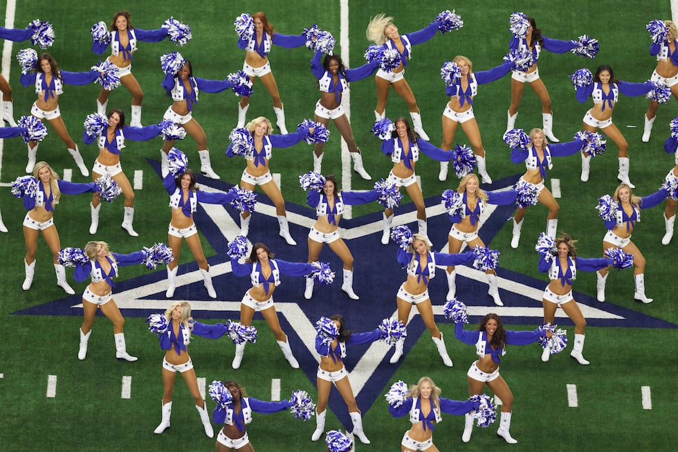 FILE - The Dallas Cowboys Cheerleaders perform during an NFL football game against the...