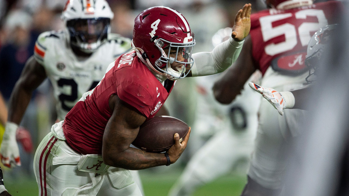 Alabama Crimson Tide quarterback Jalen Milroe (4) runs the ball as Auburn Tigers take on Alabama Crimson Tide at Bryant-Denny Stadium in Tuscaloosa, Ala., on Saturday, Nov. 30, 2024. Alabama Crimson Tide defeated Auburn Tigers 28-14.