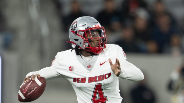 New Mexico quarterback Devon Dampier (4) throws a pass during an NCAA football game against San Diego State on Friday, Nov 8, 2024, in San Diego. (AP Photo/Kyusung Gong)
