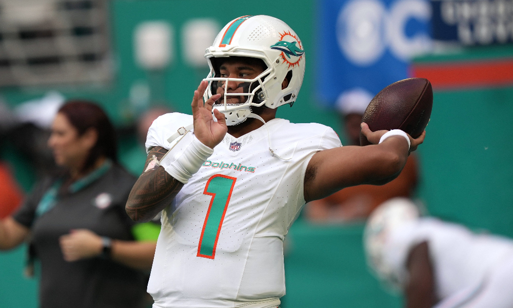 Miami Dolphins quarterback Tua Tagovailoa throws a pass in warm ups