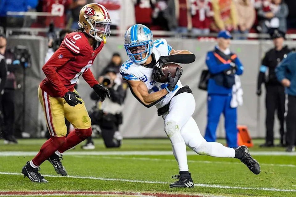 Detroit Lions wide receiver Amon-Ra St. Brown scoring a touchdownJunfu Han &sol; USA TODAY NETWORK via Imagn Images