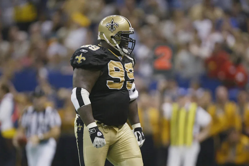NEW ORLEANS - SEPTEMBER 15: Defensive tackle Norman Hand #99 of the New Orleans Saints stands on the field during the NFL game against the Green Bay Packers on September 15, 2002 at the Louisiana Superdome in New Orleans, Louisiana. The Saints won 35-20. (Photo by Andy Lyons/Getty Images)