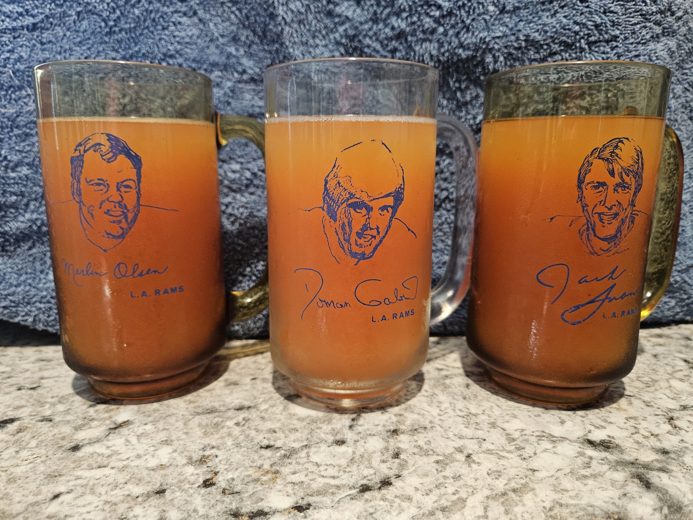 Maui storyteller Cathy Collins took this shot of her mugs from a 1972 visit from the Los Angeles Rams. From left, these mugs filled with POG commemorate Merlin Olsen, Roman Gabriel and Jack Snow. CATHY COLLINS photo