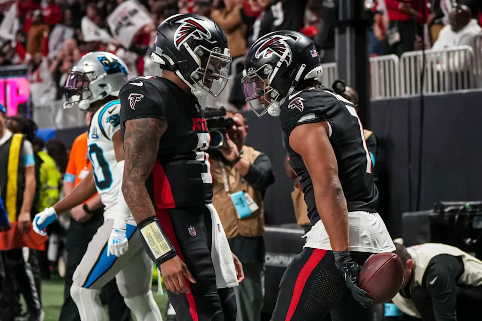 Falcons QB Michael Penix Jr. celebrates a TD with RB Bijan Robinson. Dale Zanine-Imagn Images