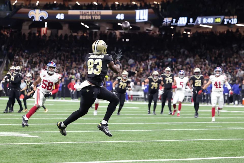 Dec 17, 2023; New Orleans Saints tight end Juwan Johnson (83) catches a touchdown pass against the New York Giants. Mandatory Credit: Stephen Lew-Imagn Images