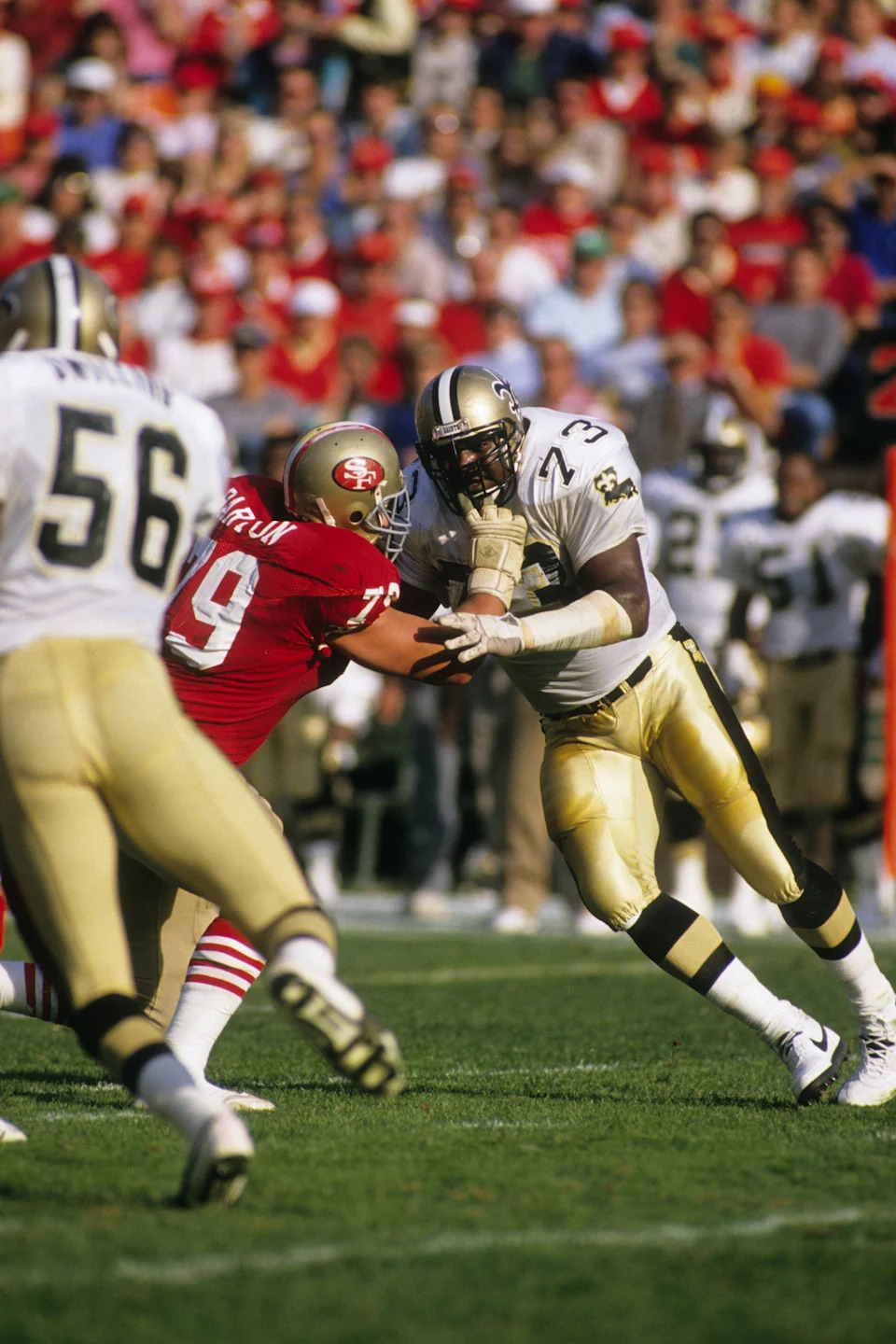 SAN FRANCISCO - DECEMBER 11: Defensive end Frank Warren #73 and linebacker Pat Swilling #56 of the New Orleans Saints pressures the San Francisco 49ers offense during the game at Candlestick Park on December 11, 1988 in San Francisco, California. The 49ers won 30-17. (Photo by George Rose/Getty Images)