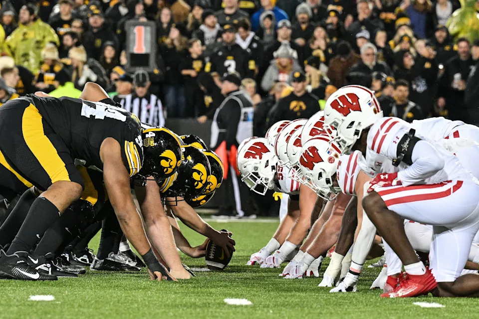 Nov 2, 2024; Iowa City, Iowa, USA; The line of scrimmage between the Iowa Hawkeyes and the Wisconsin Badgers during the fourth quarter at Kinnick Stadium. Mandatory Credit: Jeffrey Becker-Imagn Images