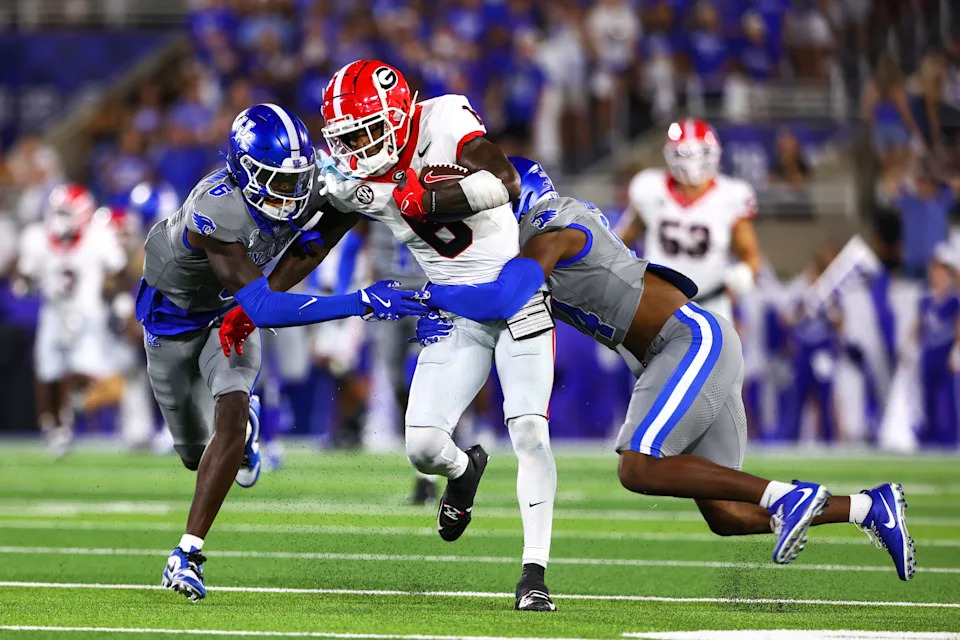 Sep 14, 2024; Lexington, Kentucky, USA; Georgia Bulldogs wide receiver Dominic Lovett (6) is pressured by Kentucky Wildcats during the second half at Kroger Field. Georgia won 13-12. Mandatory Credit: Carter Skaggs-Imagn Images